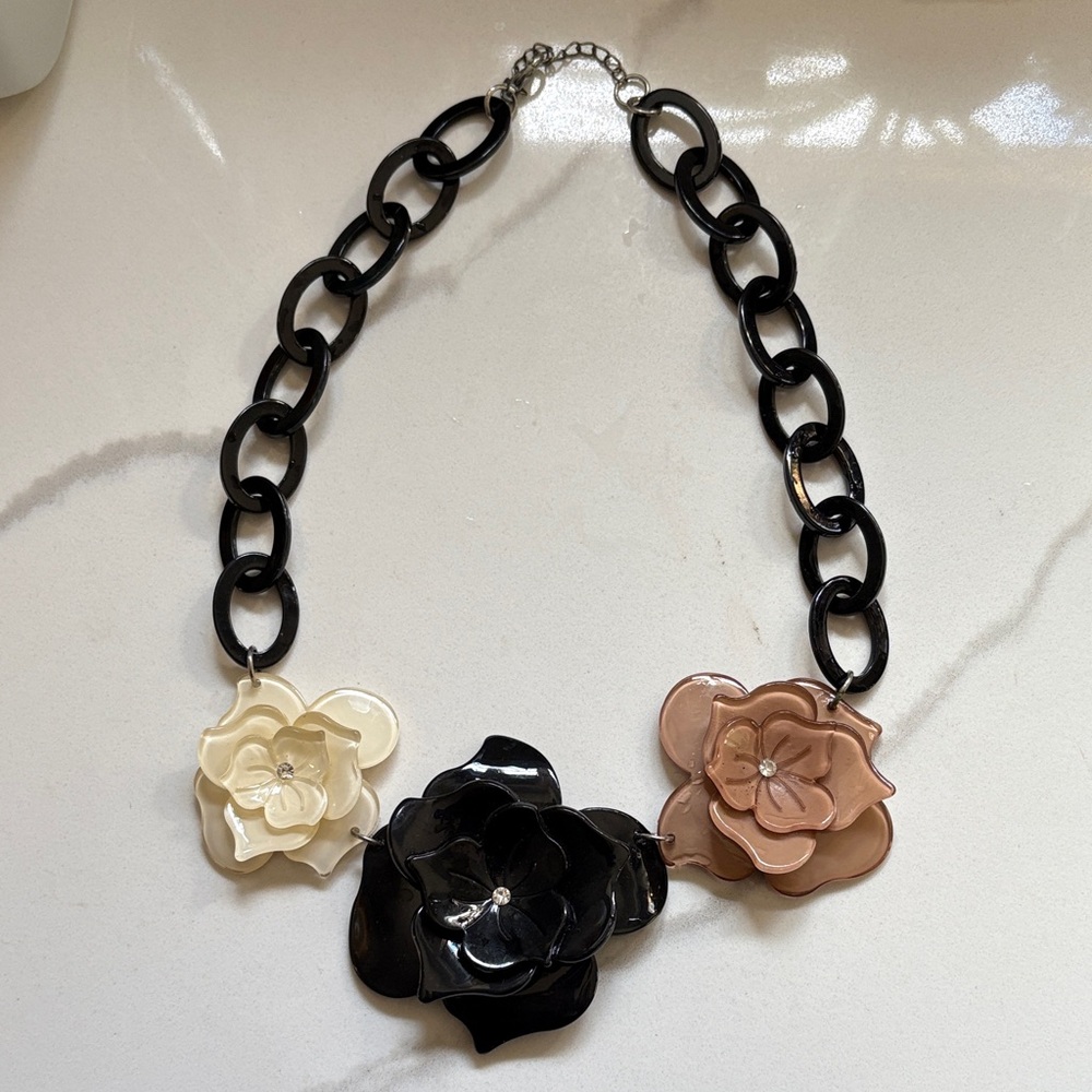 Elegant Floral Necklace with Black, Cream, and Brown Accents